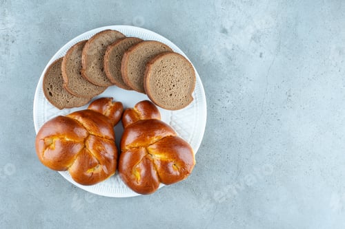 Preview: Sweet pastry and bread slices on white plate