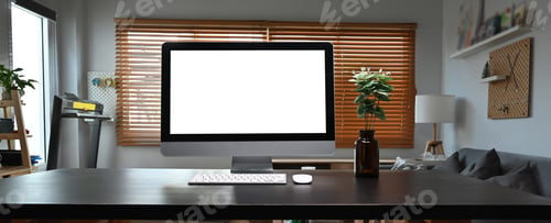Preview: Home office desk. Mock up computer with white display and potted plant on black table.