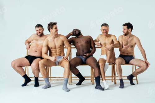 Preview: Group of multiethnic men posing for a male edition body positive beauty set