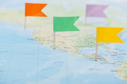 Preview: close up view of colorful flag pins on world map with copy space