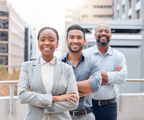 Preview: We are the dream team. Shot of a group of businesspeople standing outside together.