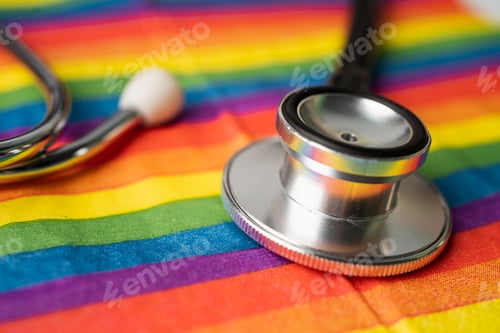 Preview: Black stethoscope on rainbow flag background, symbol of LGBT pride month celebrate annual in June