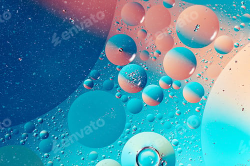 Preview: oil with bubbles on vibrant blue and pink background. Abstract background.