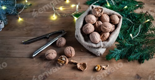Preview: festive christmas nuts tumbling from a burlap bag