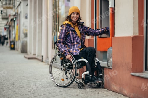 Preview: Woman with disability using credit card and atm machine
