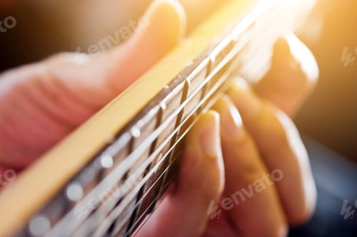 Preview: Hands of man playing electric guitar close up