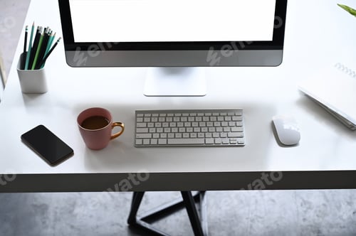 Preview: Top view workspace with empty screen computer, coffee, mobile phone and computer equipment.