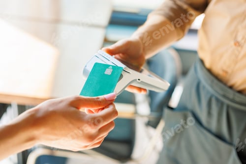 Preview: NFC credit card payment. Woman paying with contactless credit card with NFC