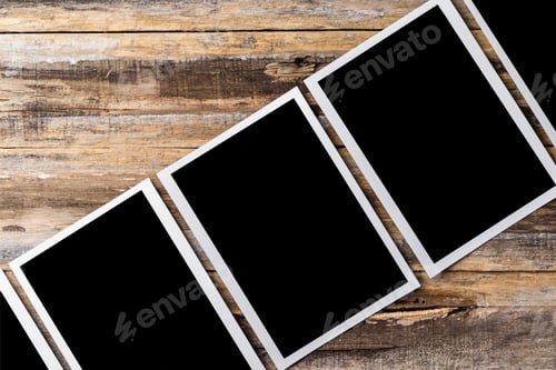 Preview: Blank photo frames for your photos on wooden background