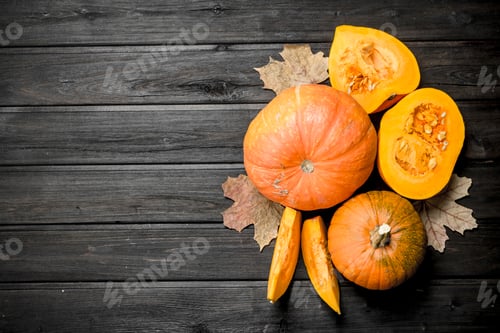 Preview: Pieces of fragrant pumpkin with leaves.