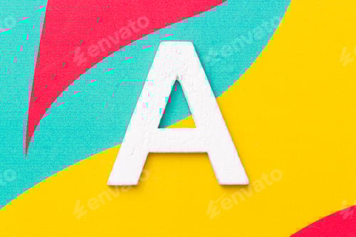 Preview: Letter A of the alphabet on colored background, top view