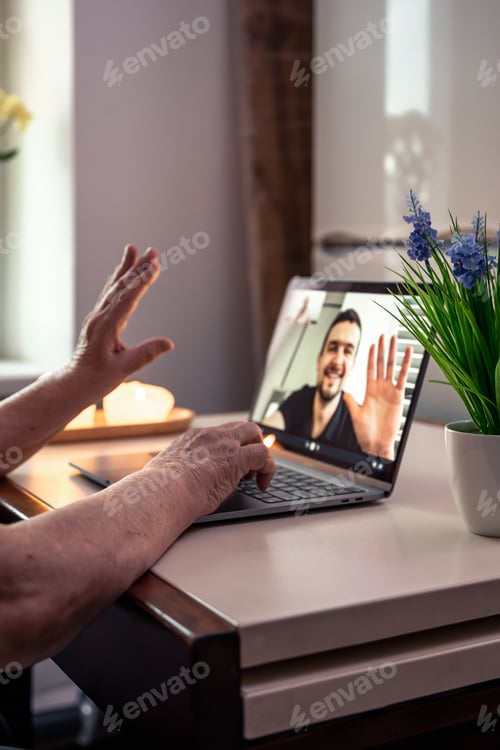 Preview: An old woman communicates with her son via video link through a laptop.