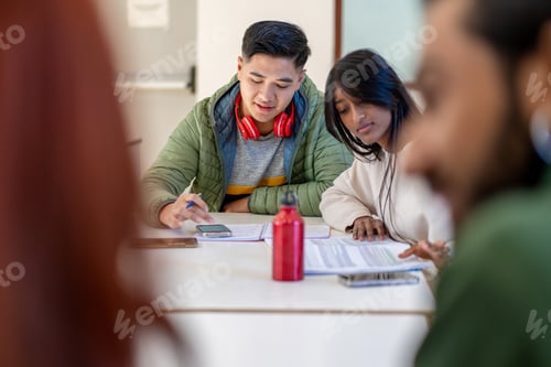 Preview: Asian students studying together, diverse friends collaborating - university project with smartphone