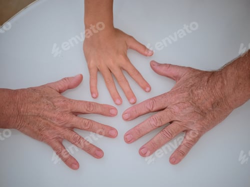 Preview: Hands of unrecognizable grandparents and kid