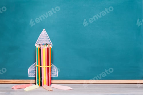 Preview: rocket made with crayons on a blackboard