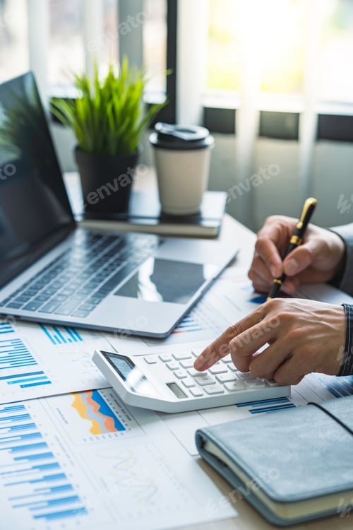 Preview: Business accounting concept, Business man using calculator with computer laptop, budget and loan pap