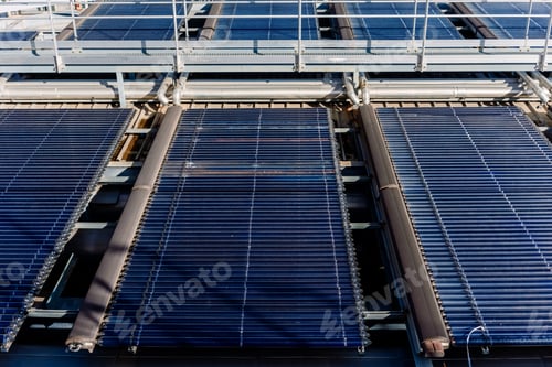 Preview: Installation on a roof of large solar thermal vacuum tube plates for heating.