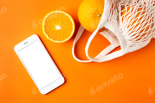 Preview: Mobile phone and oranges in eco friendly bag