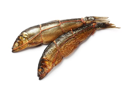 Preview: Two tasty smoked herrings on white background, top view