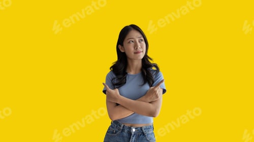 Preview: Asian woman pointing finger inviting click here