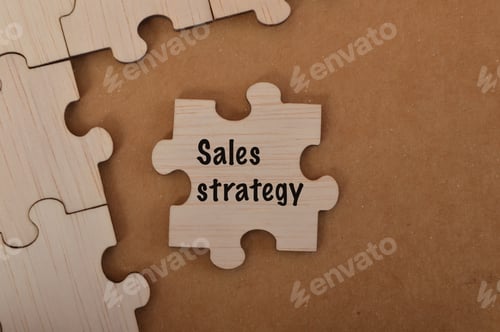 Preview: the word SALES STRATEGY is written on jigsaw puzzle.