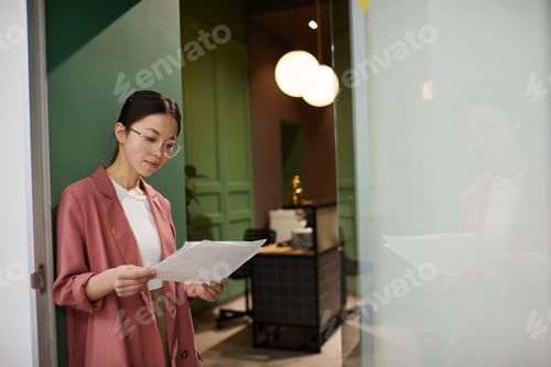 Preview: Office worker reading documents
