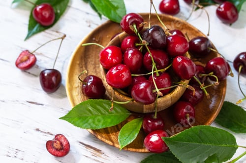 Preview: Ripe juicy berry cherry in a bowl on a kitchen rustic table.