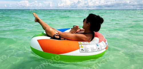 Preview: Millennial practicing float yoga and pointing her foot In direction she wants to go...