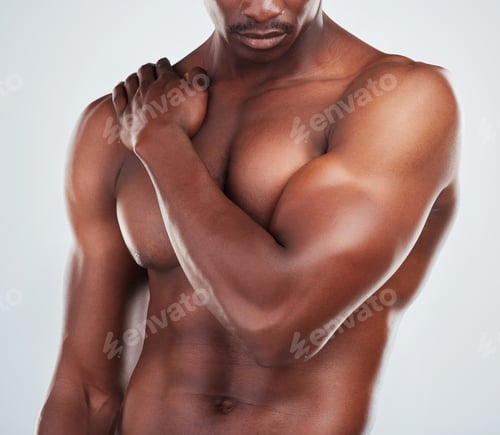Preview: One unknown muscular fitness model experiencing shoulder pain from an injury while exercising. Blac