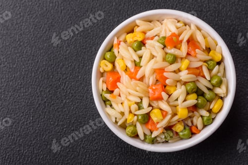 Preview: Delicious boiled rice with vegetables corn, carrots, peas with salt