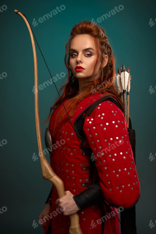 Preview: Gorgeous woman in medieval tunic with bow and arrows