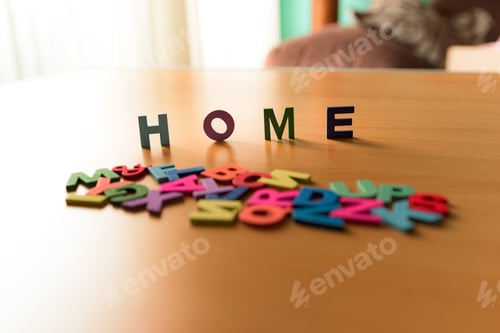 Preview: The word Home in colored letters on a wooden background