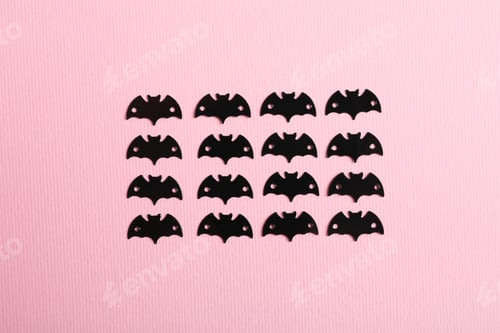 Preview: Flat lay composition with bats on pink background