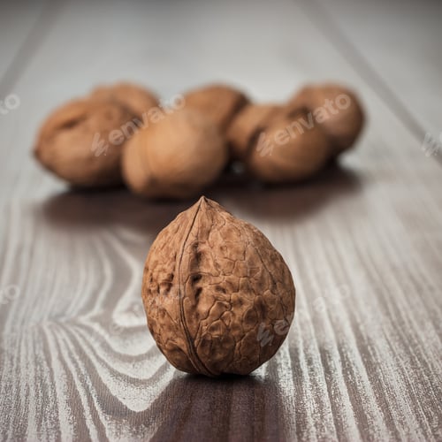 Preview: Walnuts On The Brown Wooden Table