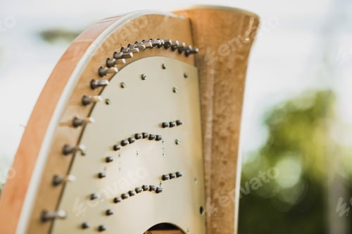 Preview: Detail of the strings and mast of a classic harp.