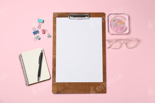 Preview: Flat lay composition with clipboard and blank paper on pink background. Space for text