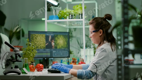 Preview: Scientist woman researcher typing biochemistry expertise on computer