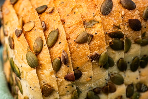 Preview: sliced pumpkin seeded bread closeup detail