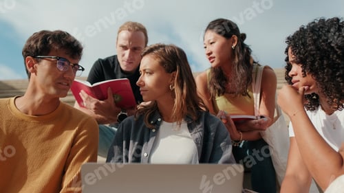 Preview: Group Of Students Studying Outdoors Together