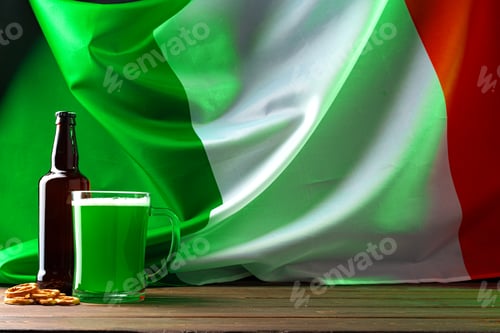 Preview: Glass of green beer against flag of Ireland