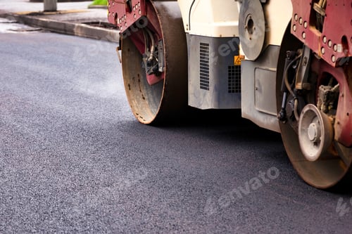 Preview: Paving Asphalt Concrete on an Urban Street During a Road Construction Activity