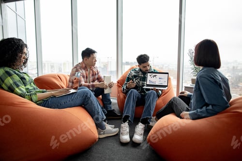 Preview: Data analysts looking at laptop with charts in workplace