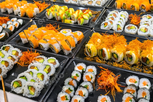 Preview: Delicious Assortment of Sushi Rolls on Display