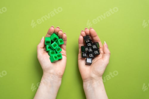 Preview: CO2 cubes and oxygen-restoring forests in hands. Compensation for human damage to nature.