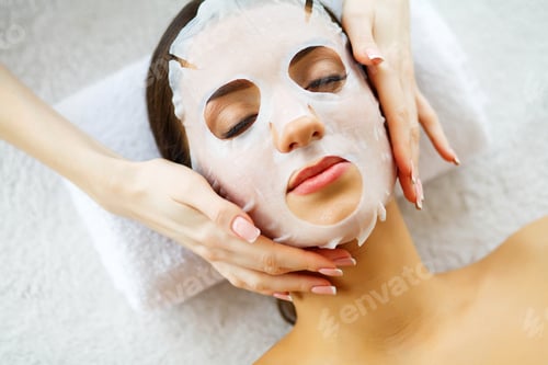 Preview: Beautiful Woman in the Beauty Salon with Face Mask. Lying on the Massage Tables.