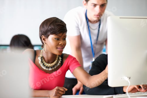 Preview: Students working on desktop computer in classroom