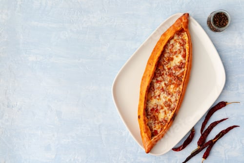 Preview: Turkish baked Pide bread on light blue wooden surface