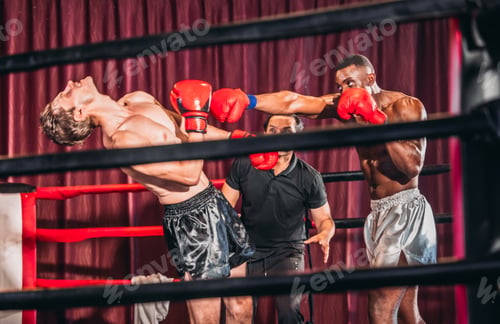 Preview: Boxing Match Between Two Fighters Inside a Ring With a Referee Overseeing the Action