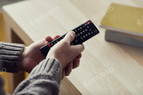 Preview: Man Holding Remote Close up