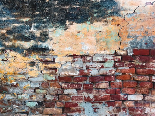 Preview: Very old brick wall with cracks and damaged stucco surface, worn layers of paint peeling off